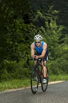 Images Dated 20th June 2014: Triathlete, 45 years, cycling, Kaiserstrassle road, Baden-Wurttemberg, Germany