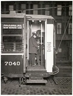 Trolley Conductor Collecting Fare