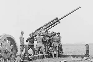 Troops with Anti-Aircraft Gun on Airfield