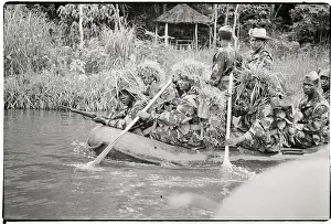 Raft Prints: Troops In Camouflage Raft Down River