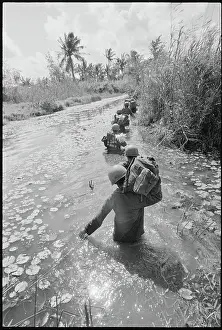 Troops Wading Through Water