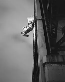 Accident Prints: Truck Dangles Over Side of Bridge