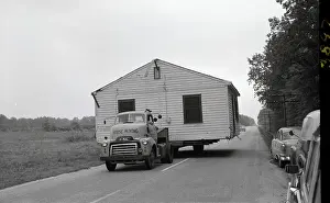 Truck Moving House On Road