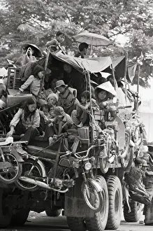 Fleeing Prints: Truck Piled With Refugees Fleeing