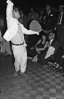 Truman Capote Doing Fan Dance W/Arm Up