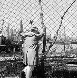 Prints of BROOKLYN, NY - MARCH 1958: Writer Truman Capote poses for a portrait on the waterfront in Brooklyn Heights (now called DUMBO) in March 1958 in New York City, New York Portraits, Artworks, and Montages from a Visionary Photographer: Truman Capote On The Waterfront