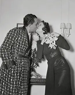 Prints of (Original Caption). Pictured above in fond embrace is Louis Prima, swing trumpeteer and his wife, Alma Rose, after her arrival from Hollywood. Alma had a seven year contract with Hollywood studio At The Movies: Trumpeter Louis Prima and Wife Alma Rose