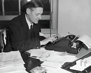 Manuscript Prints: Ts Eliot At Desk Inspecting Manuscripts