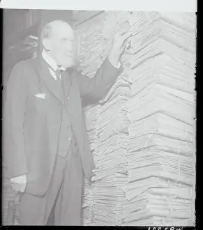 T.S. Leisenring Posing with Newspapers