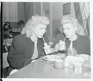 Twin Sister Actresses Drinking Beverages