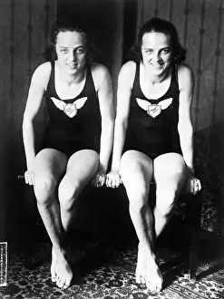 Swimmer Prints: Twin Swimmers; Seated, Wearing Bathing