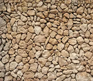 Stonewall Prints: Typical Balearic dry stone wall made of yellow and red boulders