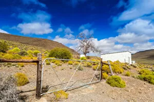 Images Dated 30th October 2012: A typical Karoo scene, white building, colourful plants and hills. Very dry and arid landscape