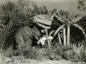 Tyrannosaurus-Like Monster Clutching Female Figure