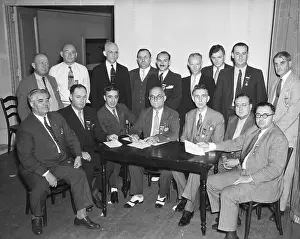 UAW Committe Seate and Posing During Meeting