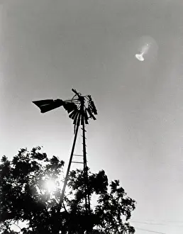 UFO Flying over Windmill
