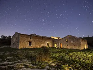 Focus On Background Prints: Uninhabited and derelict farmhouse blue night sky with stars