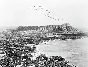 Prints of (Original Caption). The White House announced that Japanese planes attacked Hawaii. Soon after as shown here, U. S. medium bombers fly over diamond Head and beautiful Wakiki Beach at Honolulu Pearl Harbor Prints: United States Military Aircraft Responding to Pearl Harbor Attack