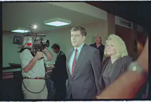 Cooperation Prints: Former University Coach Kevin Mackey and Wife Strolling to Court