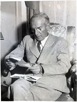 Upton Sinclair Reading A Letter