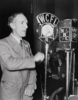 Upton Sinclair Speaking into Microphone