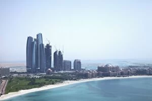 Persian Gulf Countries Gallery: Urban skyline by tropical beach
