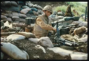 U.S. Marine Looking at Machine Gun