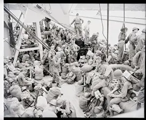 Departure Prints: U.S. Soldiers Rest On Transport