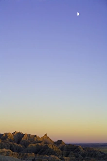 Images Dated 16th February 2006: USA, South Dakota, Badlands National Park, moon over sandstone buttes