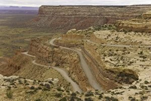 Images Dated 26th June 2006: USA, Utah, cars on dirt road climbing plateau in desert, autumn