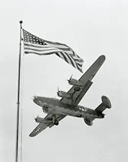 Dayton Prints: USAAF B-24 Liberator Bomber Flying Over US Flag