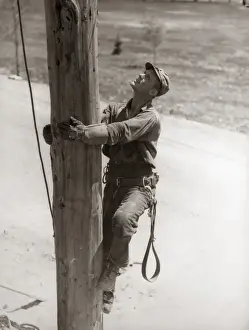 Challenge Prints: Utility Worker Man Is Climbing Electric Power Utilities Pole