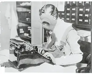 Red Cross Prints: VAD Nurse Wearing Gas Mask While Typing