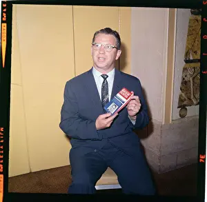 Vance Hartke Displaying His Book