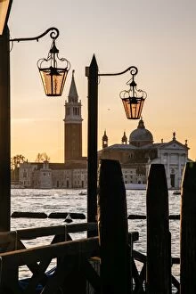 Images Dated 16th November 2013: Venetian street lanterns with Church of San Giorgio Maggiore on the backround at sunrise