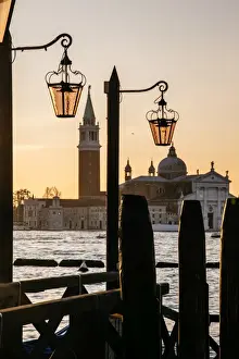 Venetian street lanterns with Church of San Giorgio Maggiore on the backround at sunrise