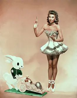 Elegance in Motion: A Ballet Journey: Vera Ellen Posing in Easter Scene Wearing Ballet Outfit