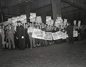 Veterans with Posters and Banners Awaiting American Troops from Spain