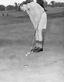 Socks Prints: Vic Ghezzi in Shorts and Socks Putting