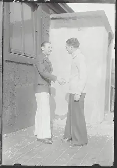 Comforting Prints: Victor Groll Shaking Hands with Another Man