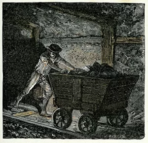 Cart Collection: Victorian coal miner pushing a minecart