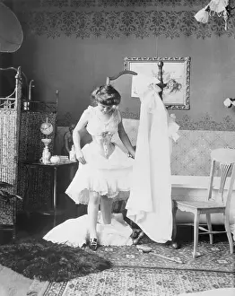 Prints of (Original Caption). Victorian Life: Intimate view of woman undressing in the bath A Journey Through Fashion History: Victorian Woman Undressing in the Bath
