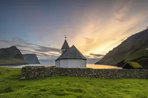 Faroe Islands Collection: Vidareidi village, Vidoy island, Faroe Islands, Denmark. Villages church at sunset