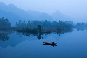 Images Dated 21st November 2014: Vietnam - Farmer go to market by boat on Suoi Yen river in early morning at My Duc