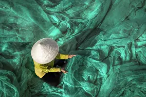 Vietnam Fishermen are repairing fishing nets