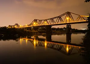 Vietnam - Reflections of Long Bien bridge on Song Hong river, Hanoi