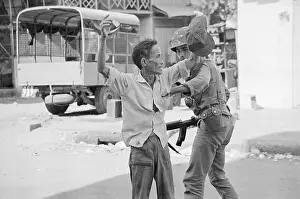 Vietnamese Being Accosted by Soldier