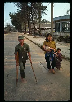 Vietnamese Trooper and Woman Passing Marines