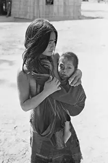 Vietnamese Woman Cuddling Her Child