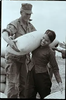 Villager Prints: Vietnamese Woman Helps US Marine